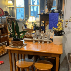 Secondhand decor and kitchenware displayed on table